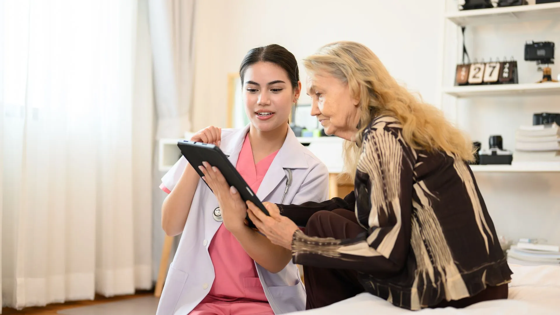 A doctor showing their hospital website to a patient
