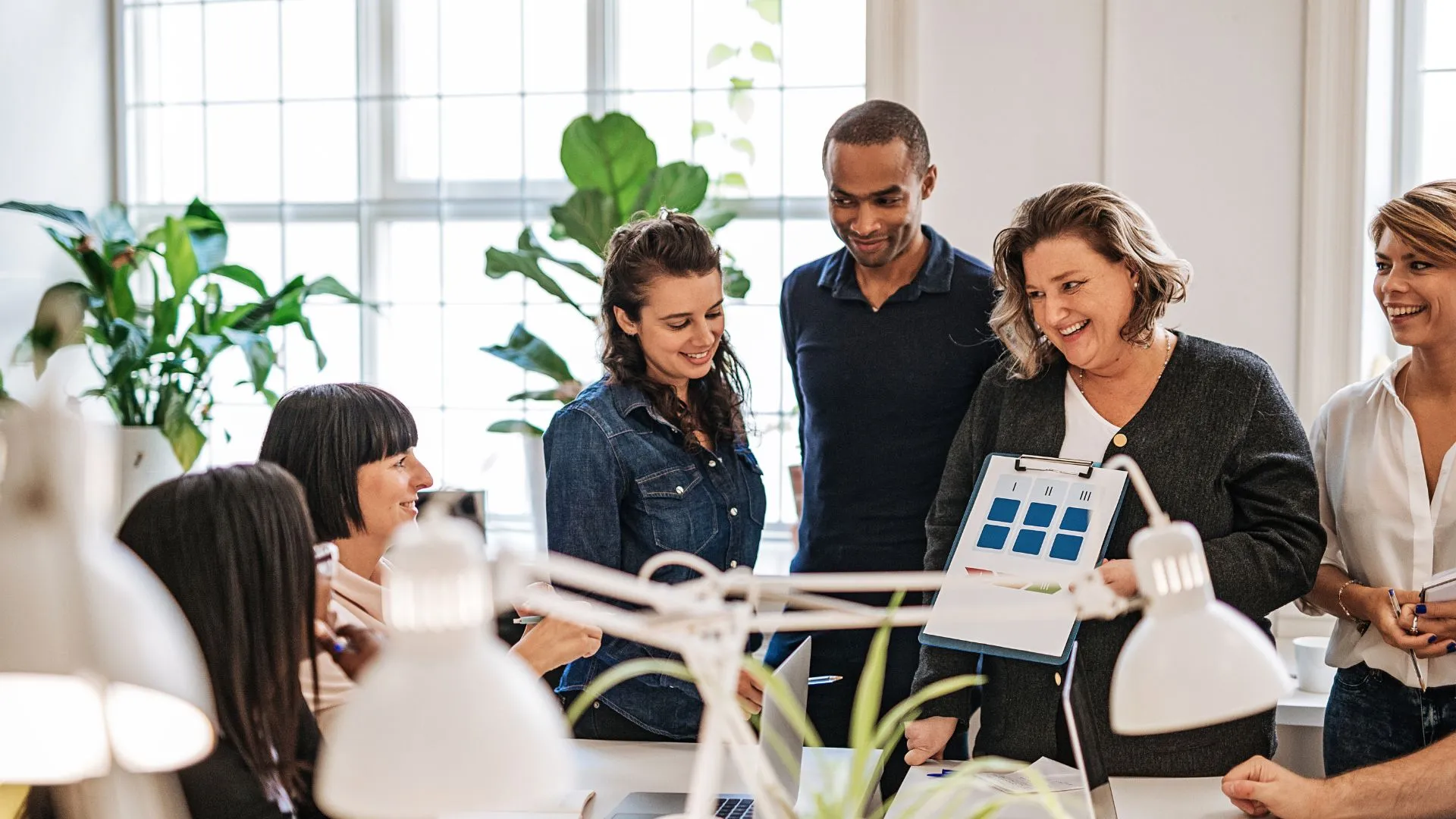 A marketing team talking about SAAS customer acquisition strategies