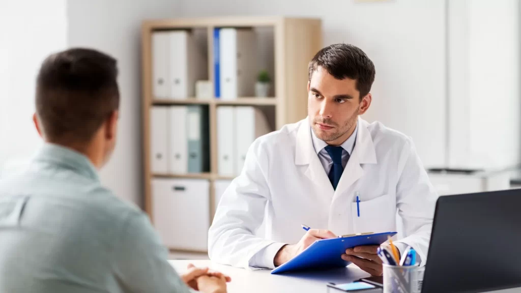 A doctor talking with a patient